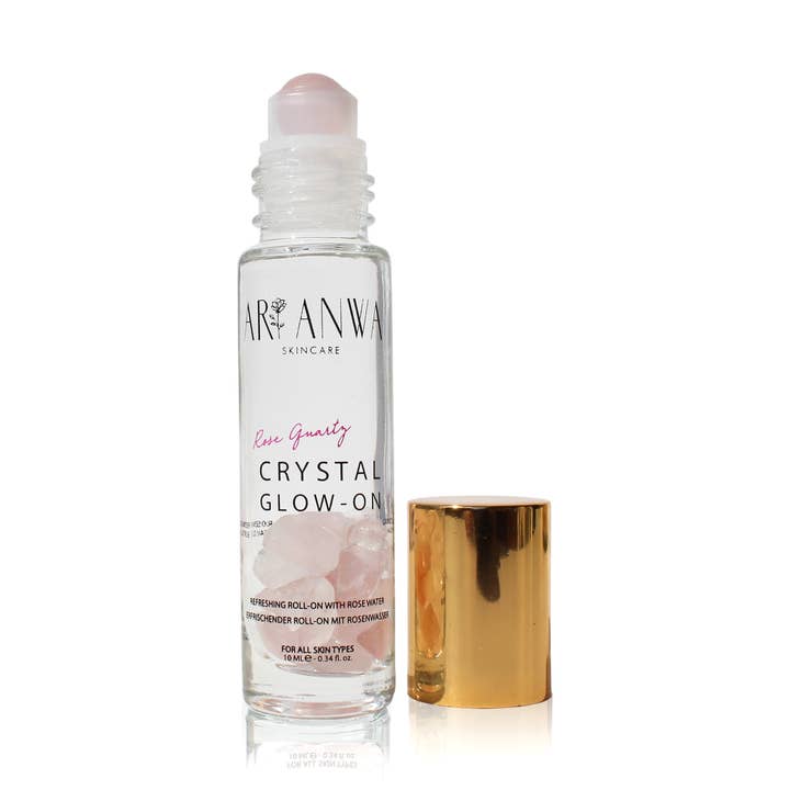 Cooling roll-on with rose quartz and rose water for wholesale by ARI ANWA Skincare