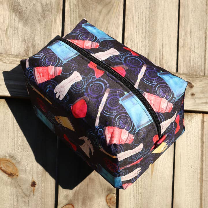 WEEPING ANGELS AND DALEKS TRAVEL POUCH for wholesale by River City Bags