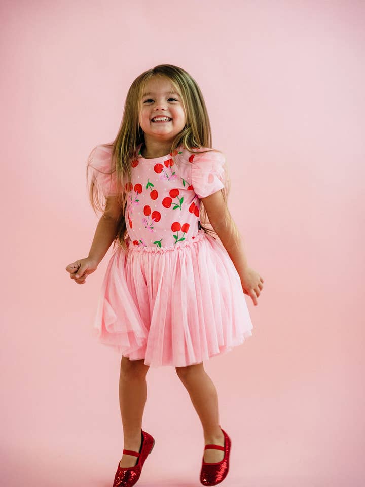 Pink POLKA CHERRY SHORT SLEEVE CIRCUS FRILL DRESS for wholesale on Faire2