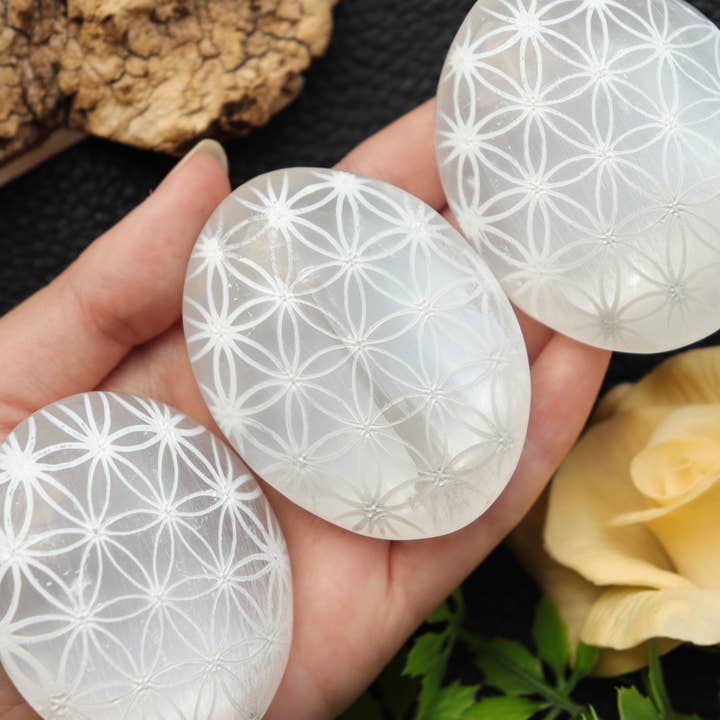 Natures Artifacts Inc – wholesale Spiritual stone/crystal – Selenite Engraved Palm Stone with Flower of Life1