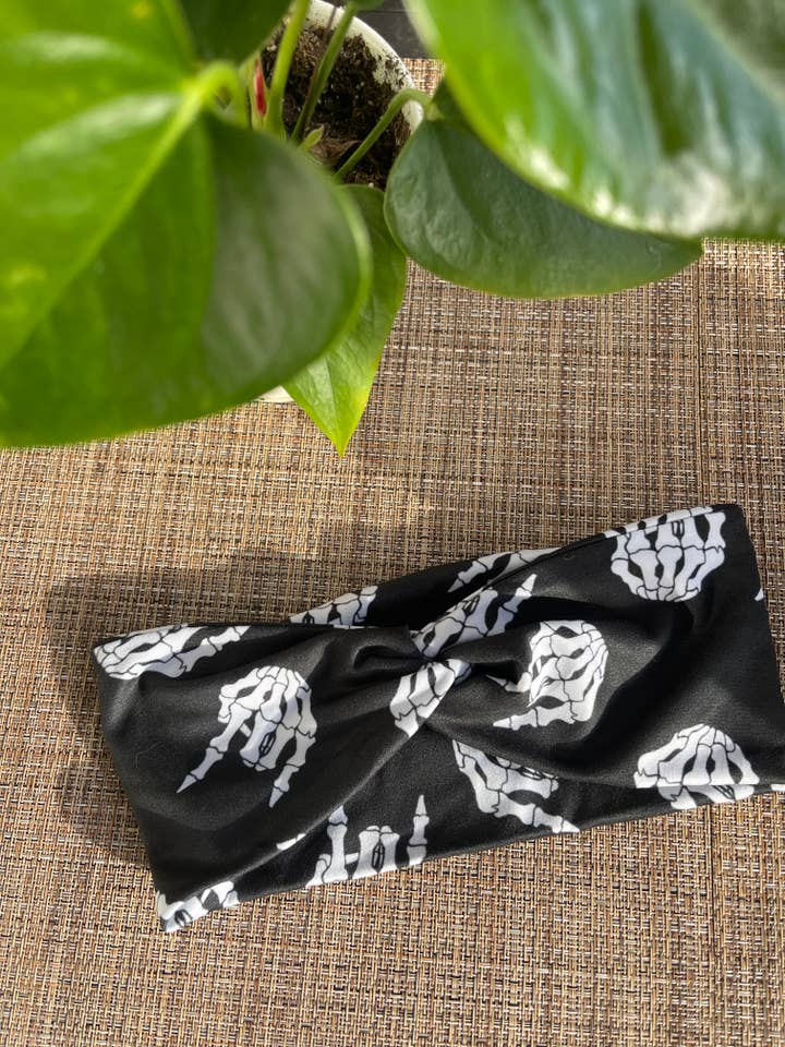 Rock on Skulls Black Twist Headband for wholesale by Radiant Wear