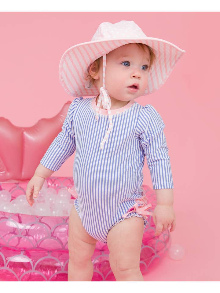 RuffleButts + RuggedButts - Wholesale Rashguard - Baby - Baby Girls Periwinkle Blue Seersucker Long Sleeve One Piece Rash Guard Swimsuit with Signature Rear Ruffles
2