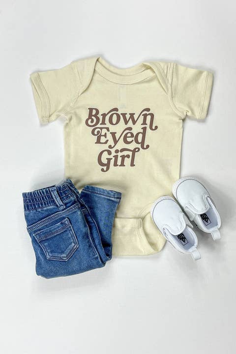 Brown Eyed Girl Baby Onesie | Baby Girl Graphic Bodysuit | Cute Baby Shower Gift for wholesale by The Mini Mart Studio