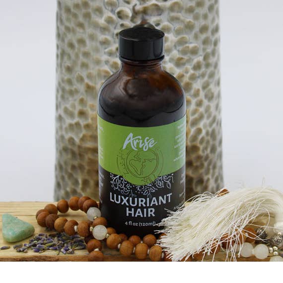 Huile capillaire luxuriante pour la vente par Arise Balanced Wellness