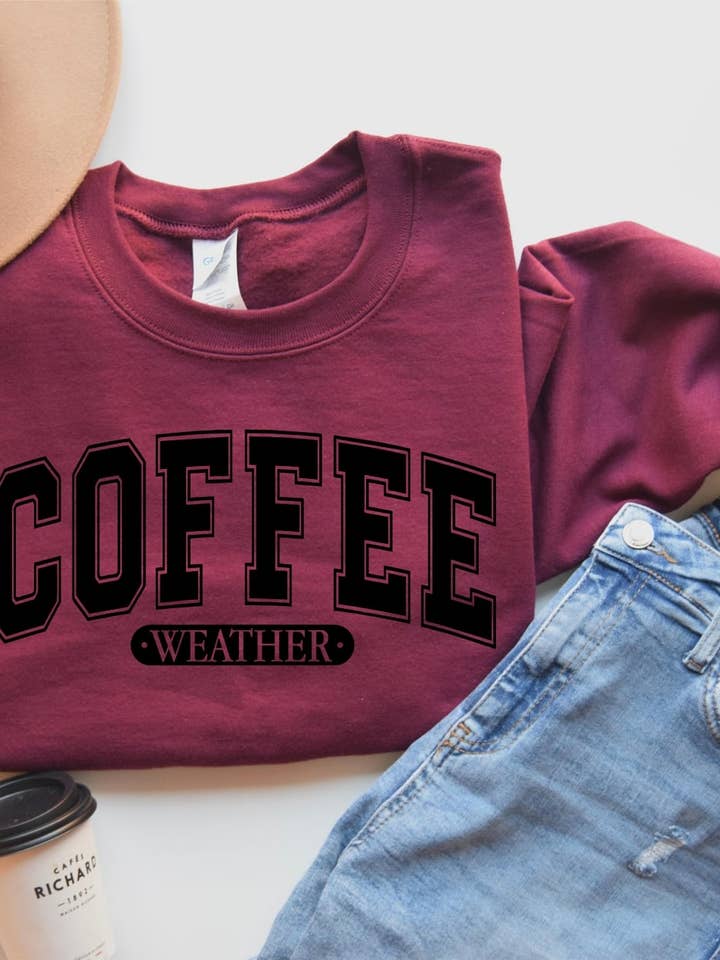 COZY 2025 maroon Coffee Weather Winter Graphic Sweatshirt and other Purchase Wholesale coffee weather. Free Returns & Net 60 Terms on Faire trending on Faire.