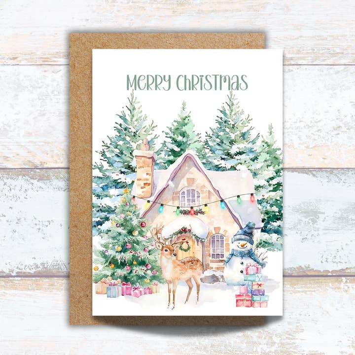 Merry Christmas Cottage Card with Reindeer and Snowman for wholesale by Designs by Michaela