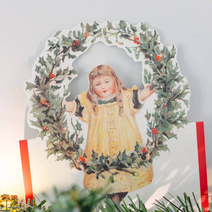 Biglietto di Natale nostalgico con bambina e corona di agrifoglio per la vendita all'ingrosso da parte di Mamelok