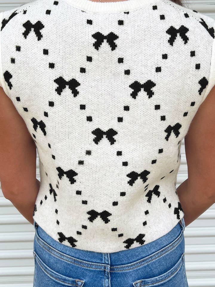 White Bow Pattern Buttoned Side Cropped Sweater Vest for wholesale on Faire