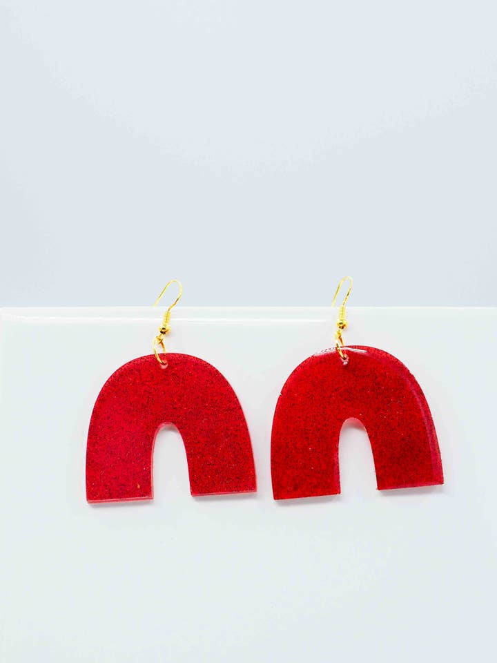 Bögen in rotem Glitzer für den Großhandel von West Moon Collective