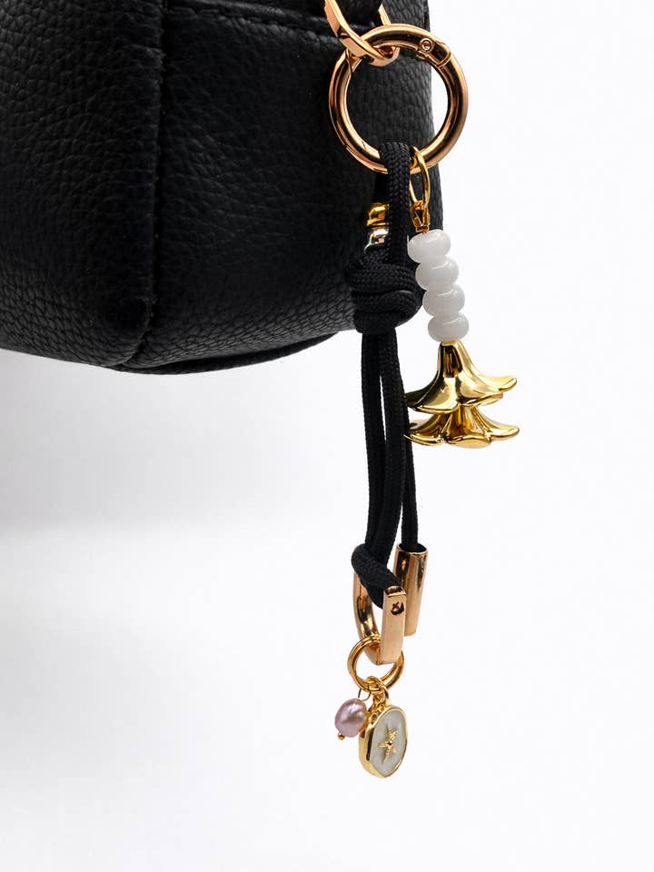 Leo Charm – Bag & Accessory Charm (Black, Plumeria) for wholesale by Leo & Lei