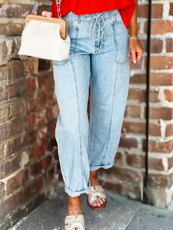 Jean à cordon de serrage avec détail de couture exposée pour la vente par 66DISCO