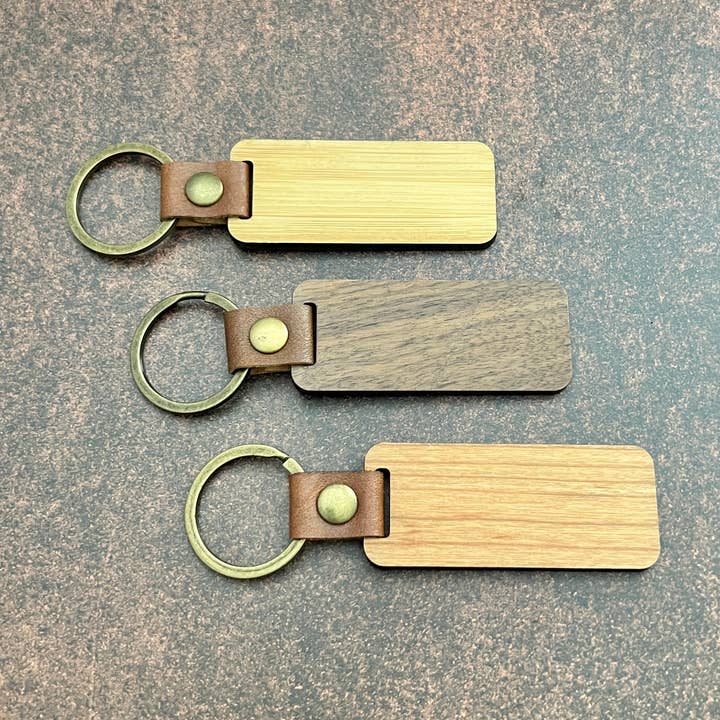 Walnut, Cherry, and Bamboo Finished Wood Keychain Blanks for wholesale by The Cutest Gifts