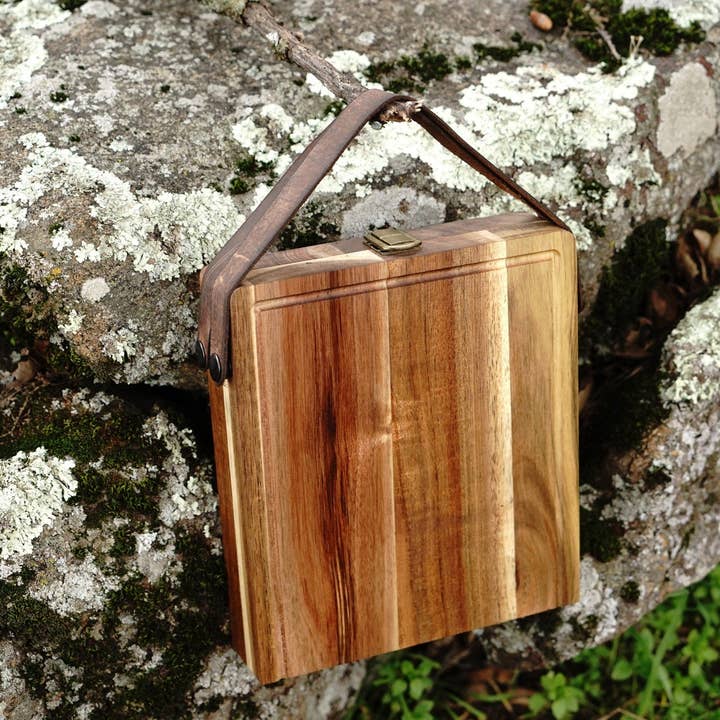 Foldable Cutting / Serving / Picnic Board with Magnetic Internal Utensil Storage and Leather Handles for wholesale by Backwoods Provisions