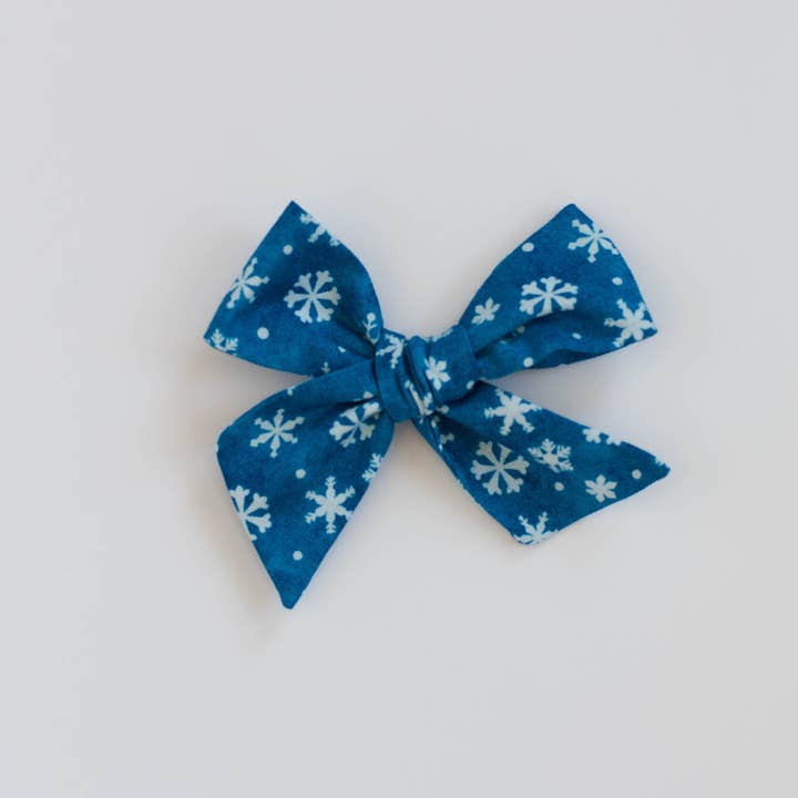 Blue and White Snowflake Bow for wholesale by Wanderlust and Mayhem
