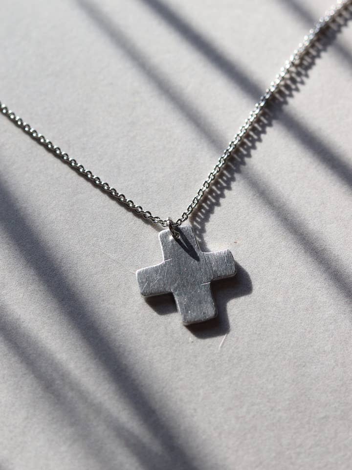 Chunky Silver Aluminum Cross Necklace for wholesale by Cedar and Cypress Designs