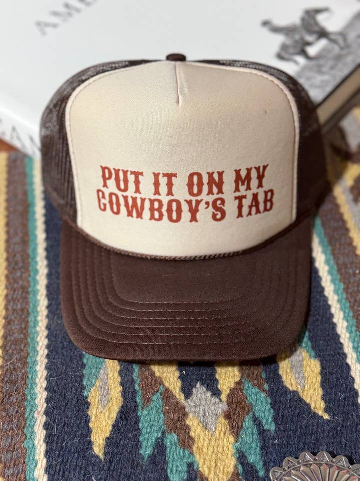 Put It On My Cowboy's Tab Trucker Hat for wholesale by Wild Junkie