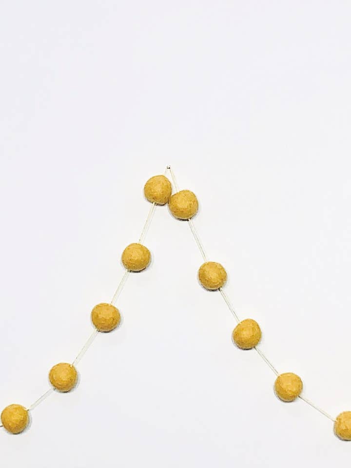 Pompom garland, yellow for wholesale by Giftsland