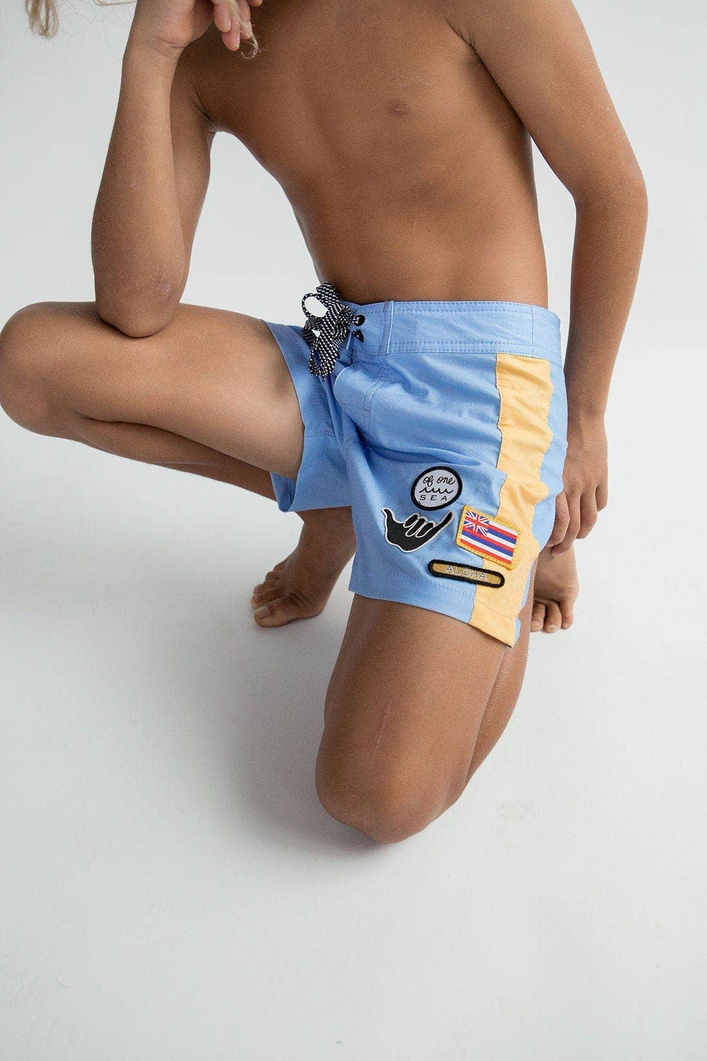 Kid’s Boardshorts in Light Blue and Yellow Colorblock Patch for wholesale on Faire3