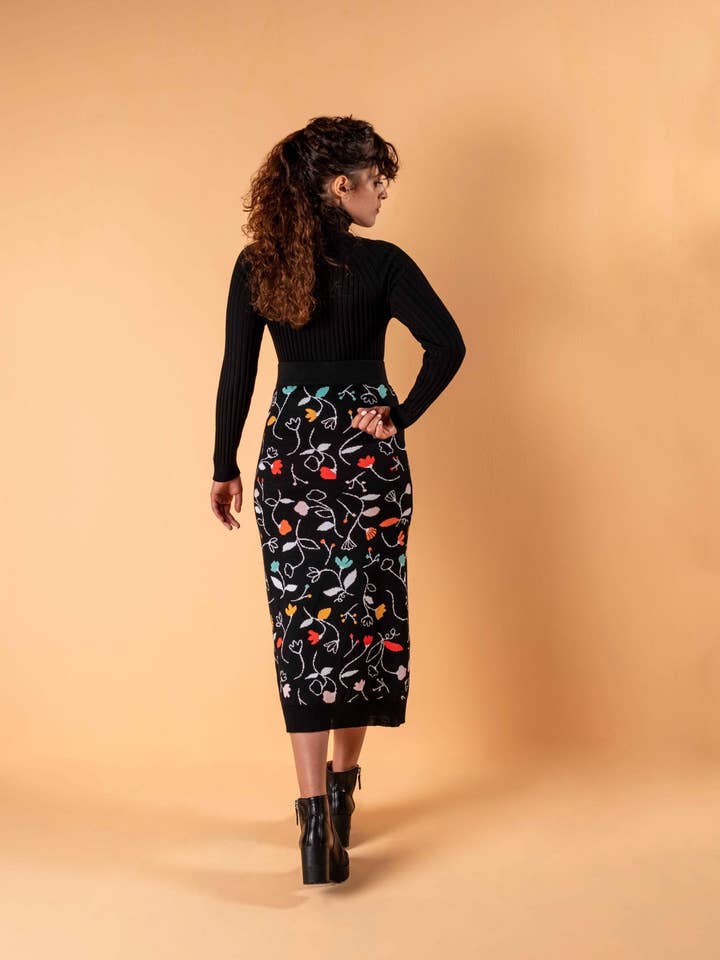 Black merino wool skirt with colorful flowers for wholesale by Magical Crisálida