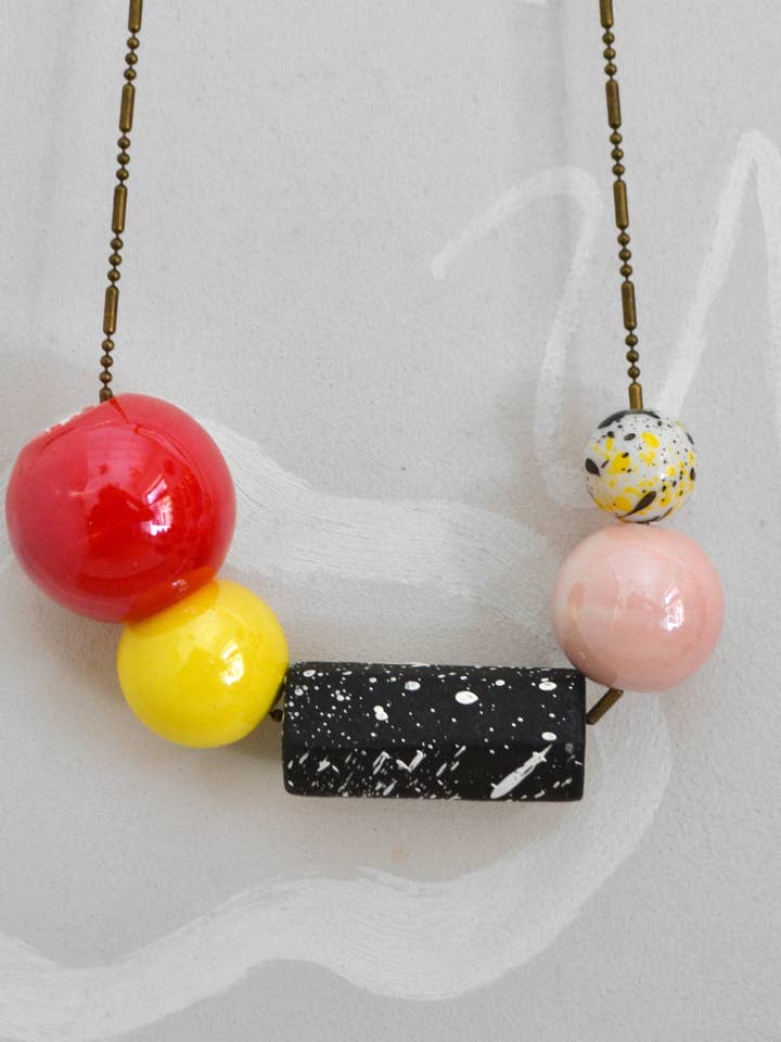 Women's necklace ceramic and wood universe red for wholesale by Rollitoasí