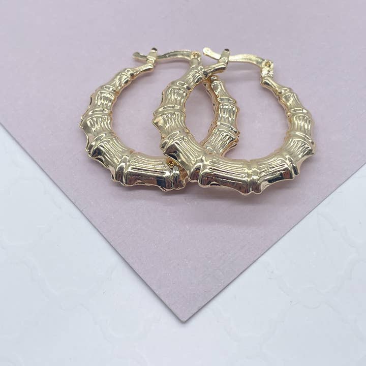 Boucles d'oreilles créoles en bambou texturé plaqué or 18k pour la vente par Milie