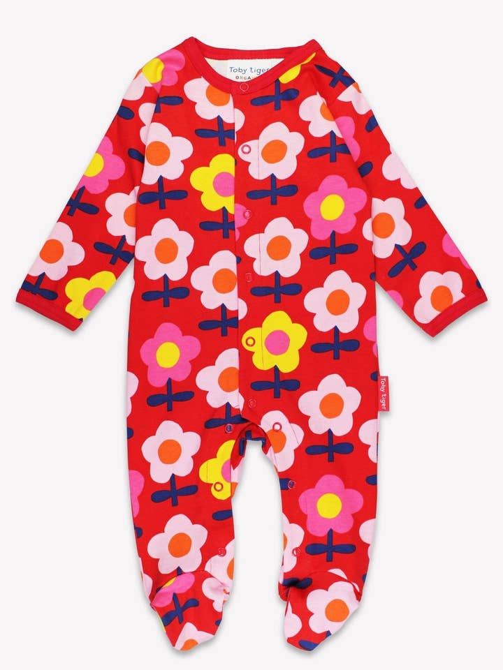 Pijama de bebé de algodón orgánico de una pieza con pies y estampado de flores retro. para venta al por mayor de Toby Tiger GmbH