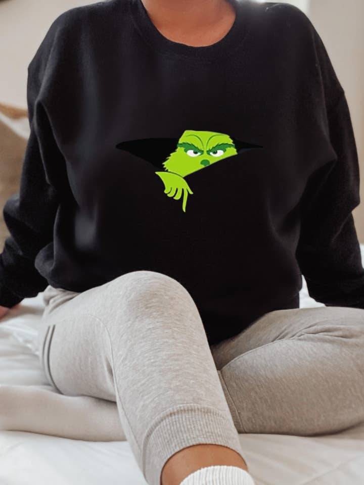 Cozy Grinchmas Sweatshirt – Perfect for a Playful Holiday for wholesale by Luxe Noire