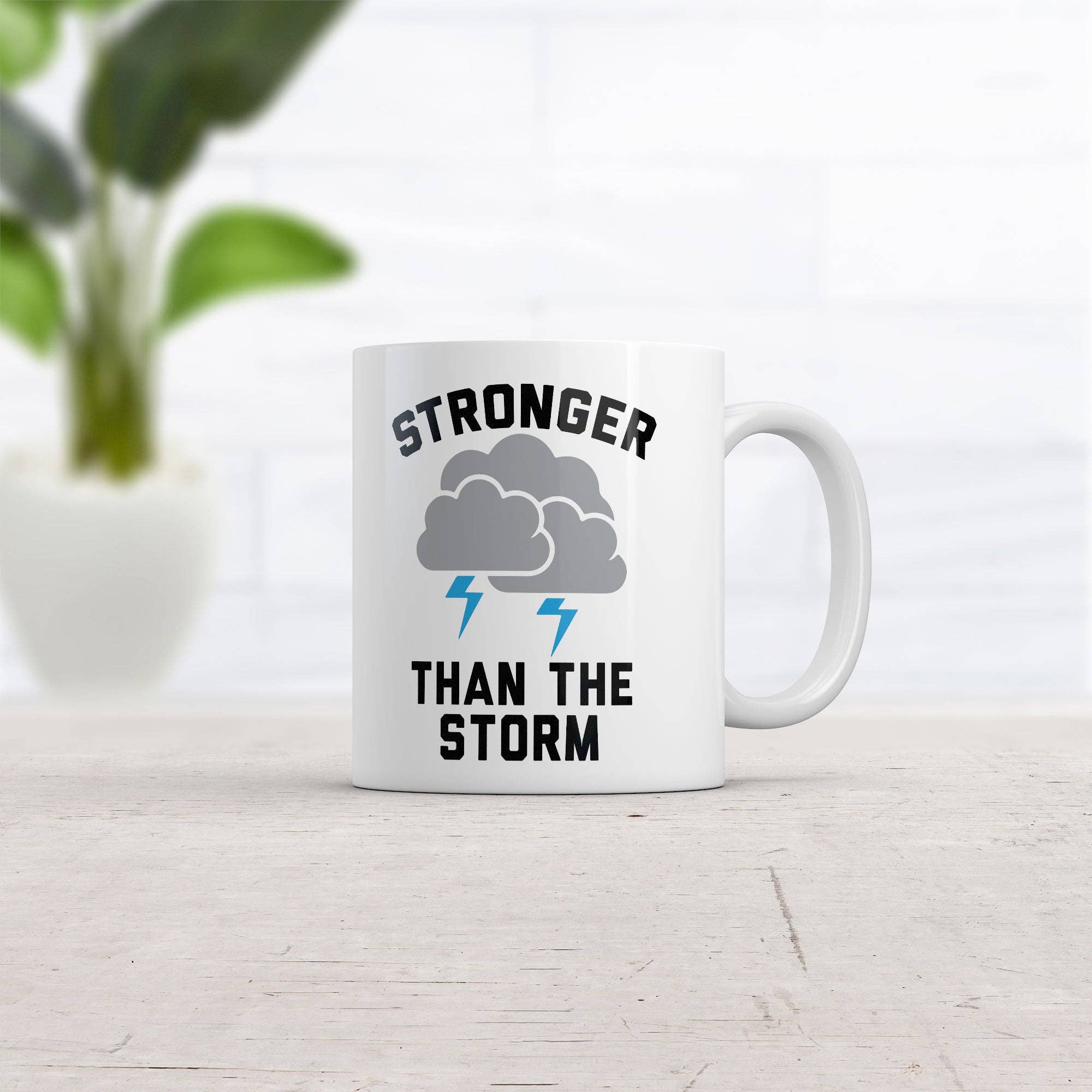 White Stronger Than The Storm Mug for wholesale on Faire1