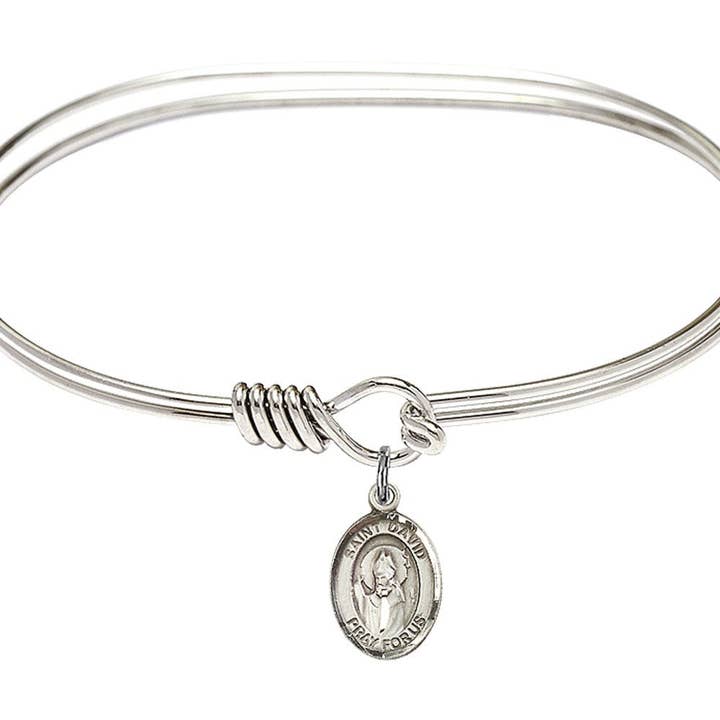 Saint David of Wales Sterling Silver Charm on a 7 inch Oval Eye Hook Rhodium Bangle Bracelet for wholesale by NYMAN JEWELERS