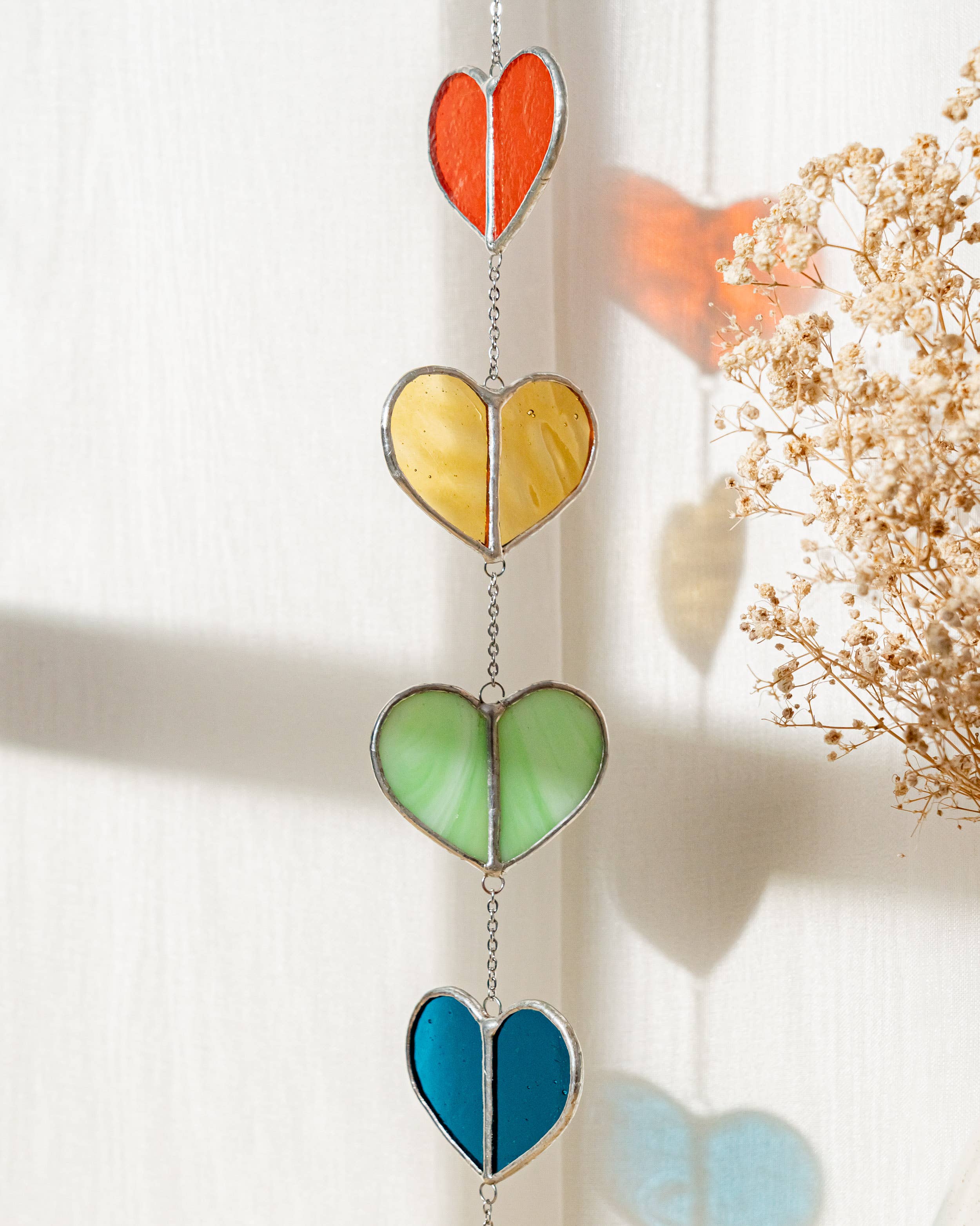 MondoBellissimo - Vendita all'ingrosso Bandierine/Ghirlande - Ghirlanda a cuore in vetro colorato F229