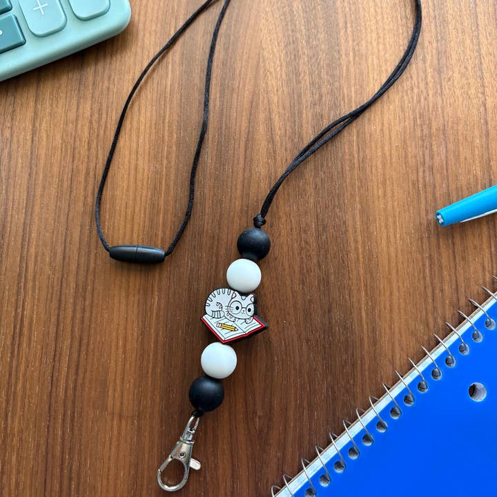 Silicone Cat Laying on Book Lanyard-20” L w/Breakaway Clasp for wholesale by Katesy Things