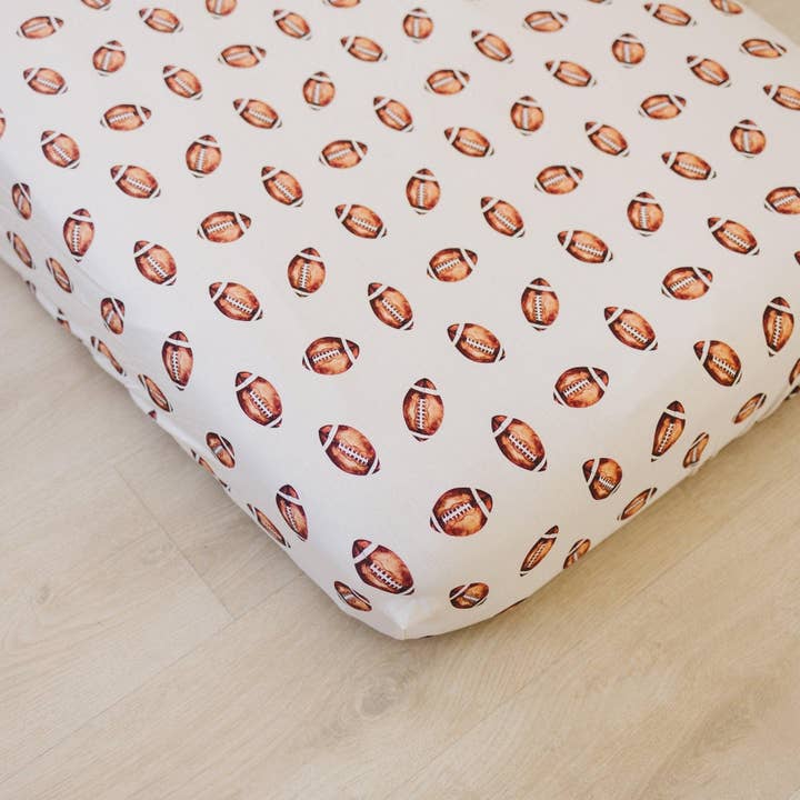 Football Print Bamboo Crib Sheet for wholesale by Little Joy Co.