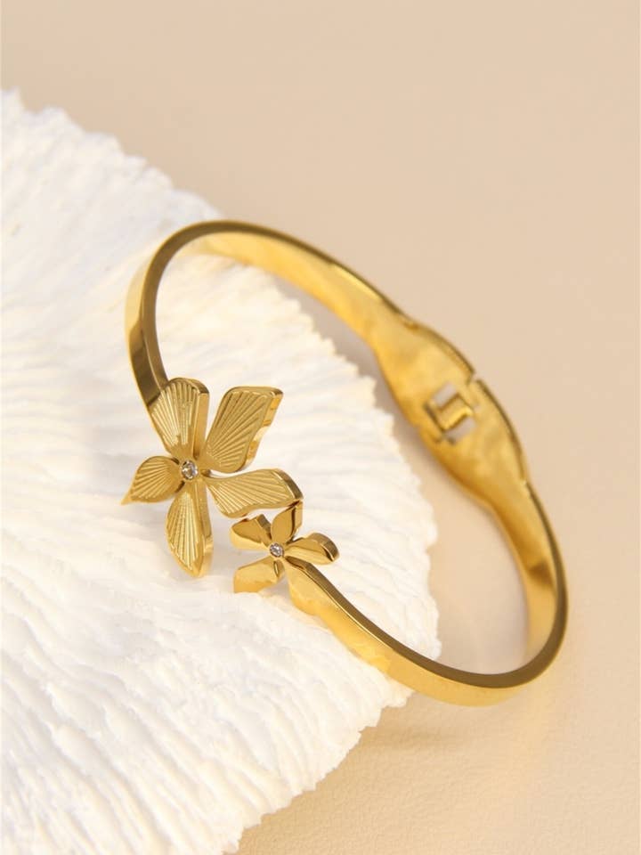 Floral Elegance Stainless Steel Flower Bangle Bracelet for wholesale by BELLISSIMA BIJOUX