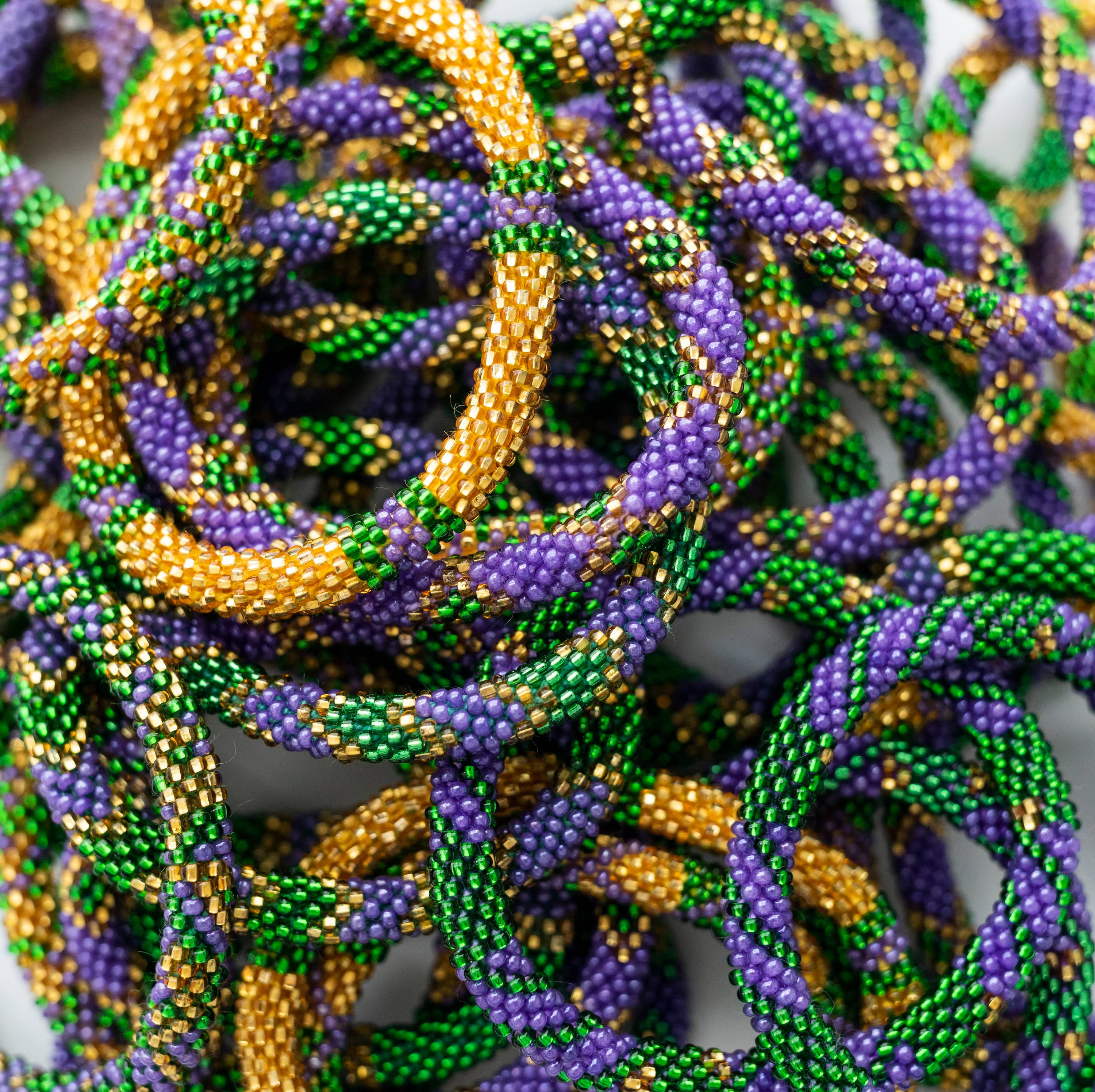 Aid Through Trade - Wholesale Beaded Bracelet - Roll-On® Bracelets Mardi Gras - Set of 12 💜💛💚2