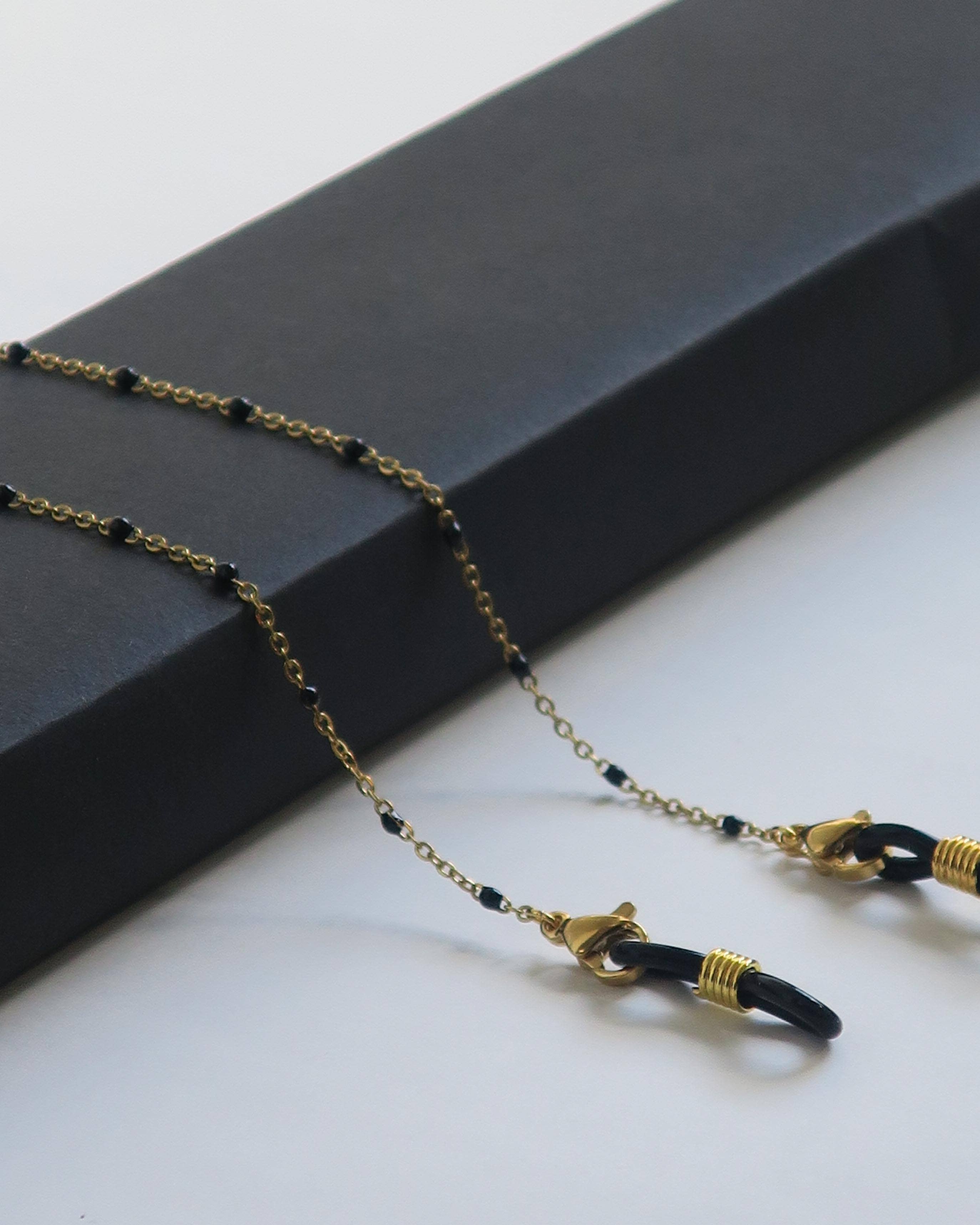 Atelier Kat H - Wholesale Sunglasses/Eyeglasses Strap - Women's - Gold eyeglass chain with black pearls model “Alhena”1
