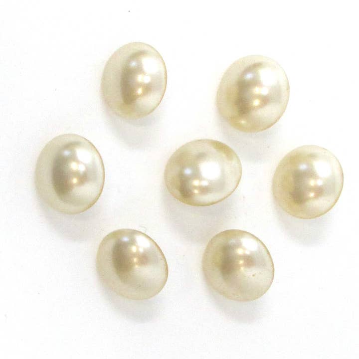Vintage pearlized glass buttons for wholesale by Exquisite Fabrics