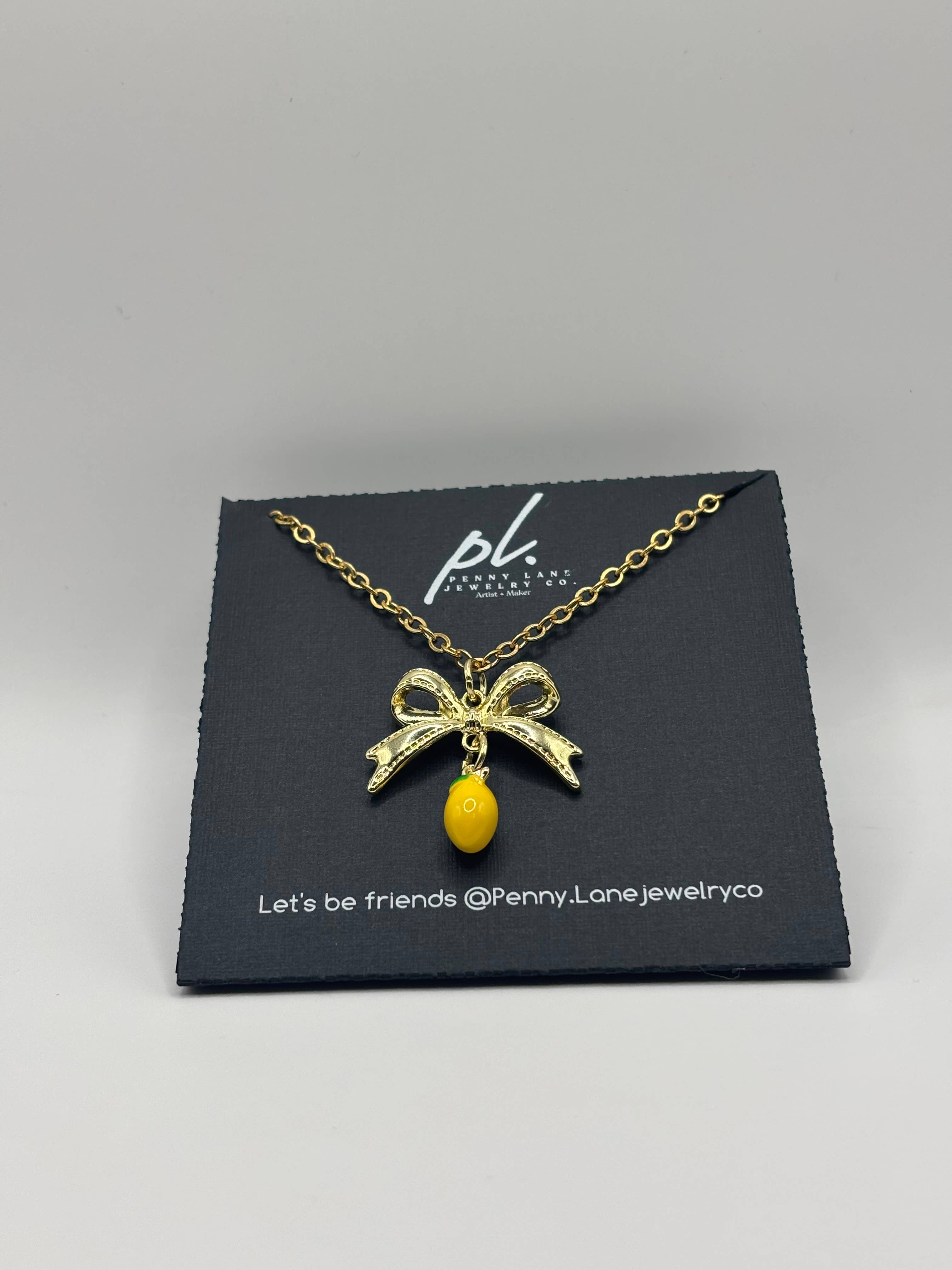 Penny Lane Jewelry Co - Wholesale Pendant/Charm Necklace - Daphne Gold Lemon Bow charm necklace 4