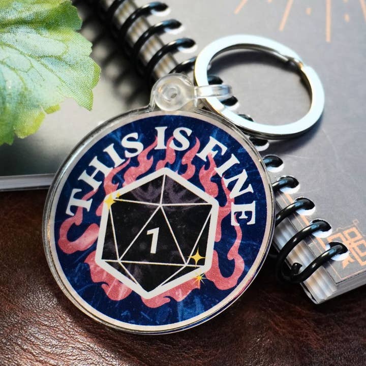 This Is Fine Nat 1 Keychain for wholesale by Minva Tabletop Design Co