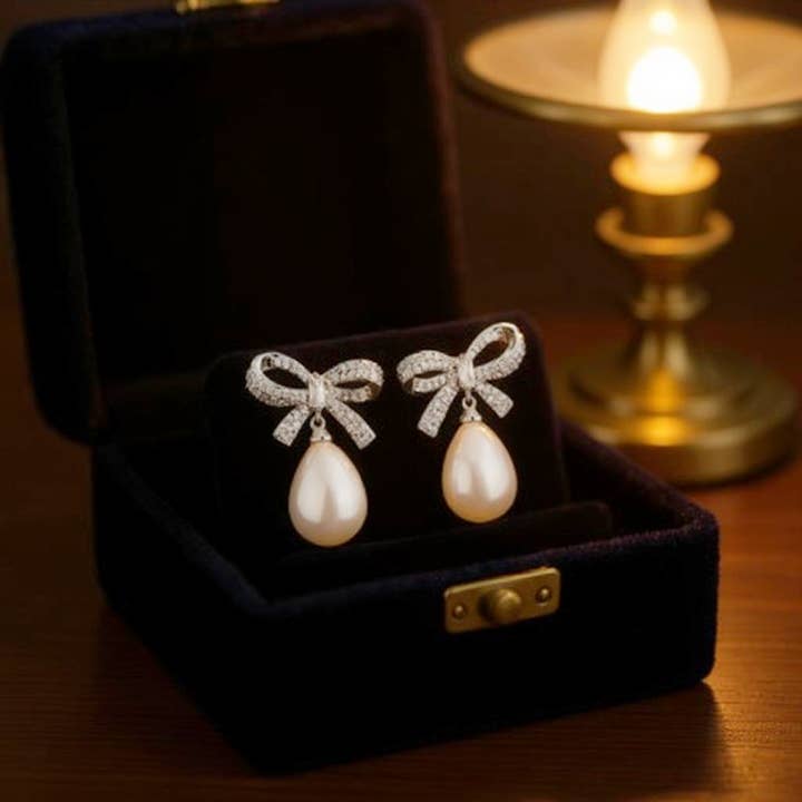 Athena Bridal Jewellery - Wholesale Dangle Earrings - CUBIC ZIRCONIA COLLECTION - GLAM BOW EARRINGS - SILVER CZER86