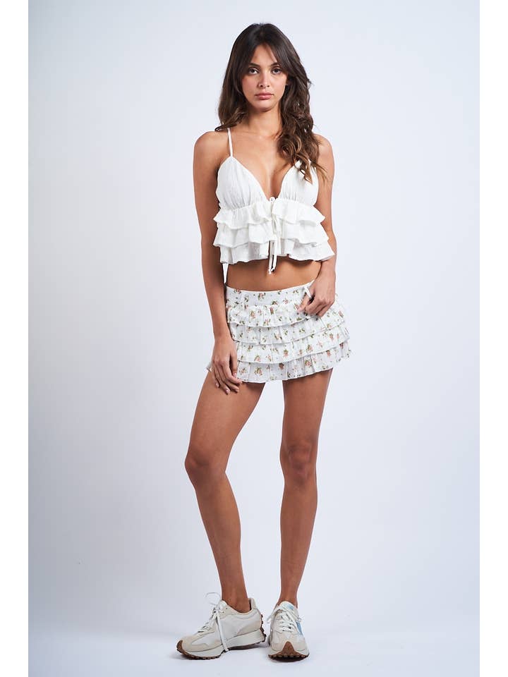 OEILLET BLANC CROP TOP À VOLANTS SANS MANCHES BLANC À OEILLETS EN FORME DE CŒUR en vente sur Faire1