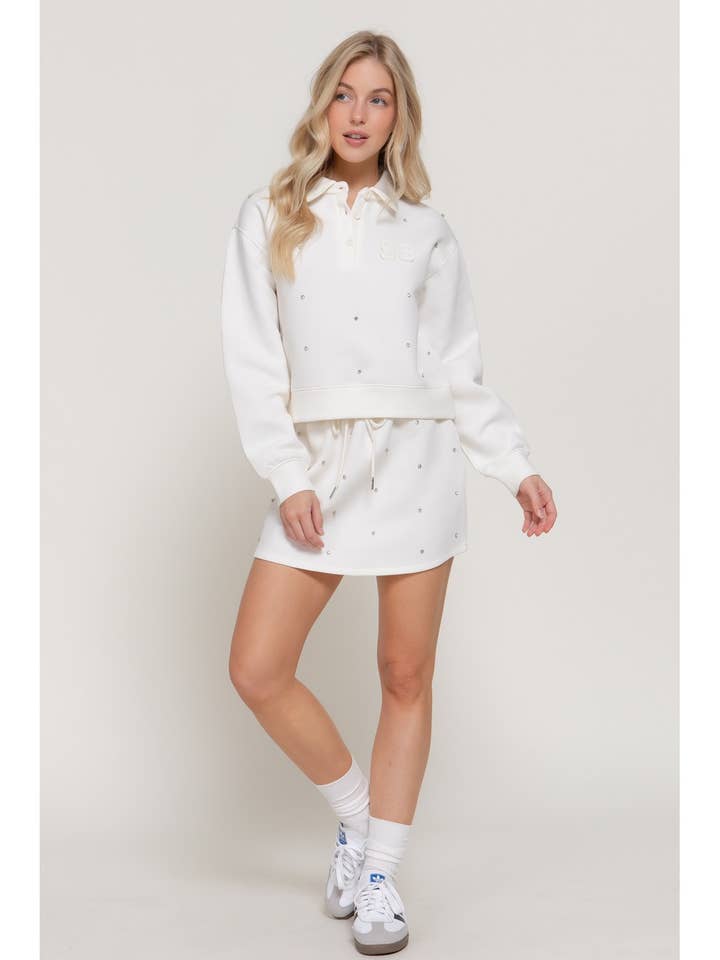 CONJUNTO DE POLO E MINI SAIA EM TECIDO SCUBA por atacado de ITSSY