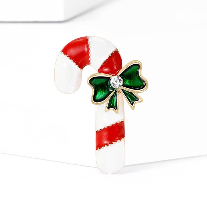 RedWhite Red & White Candy Cane Christmas Brooch with Green Bow for wholesale on Faire