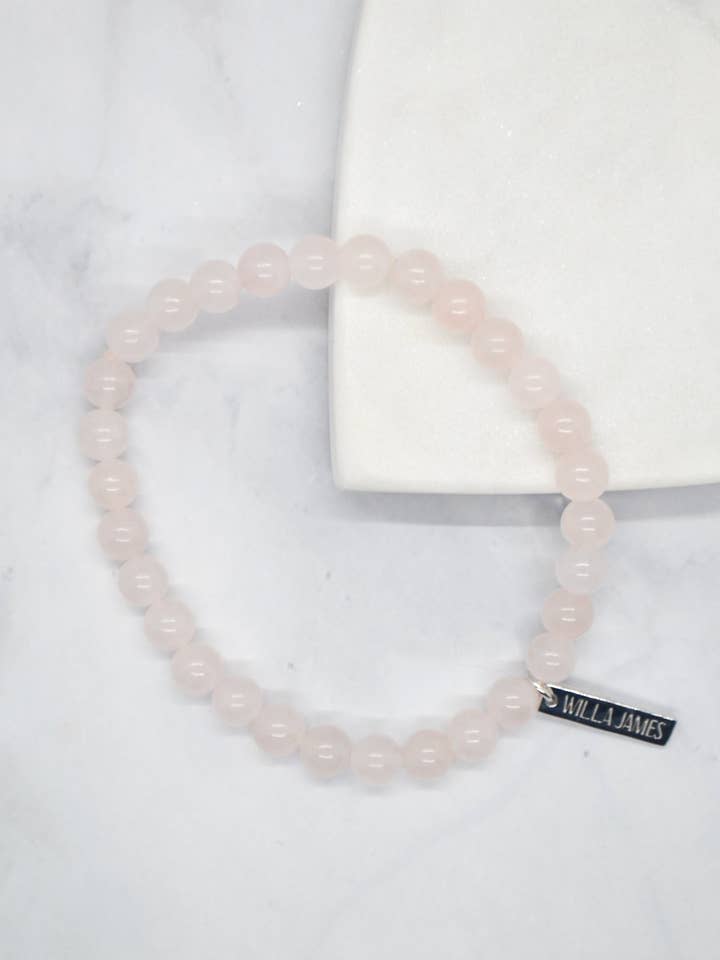 Love and Devotion White Rhodium Plate Polished Rose Quartz Stretch Bracelet for wholesale by Willa James