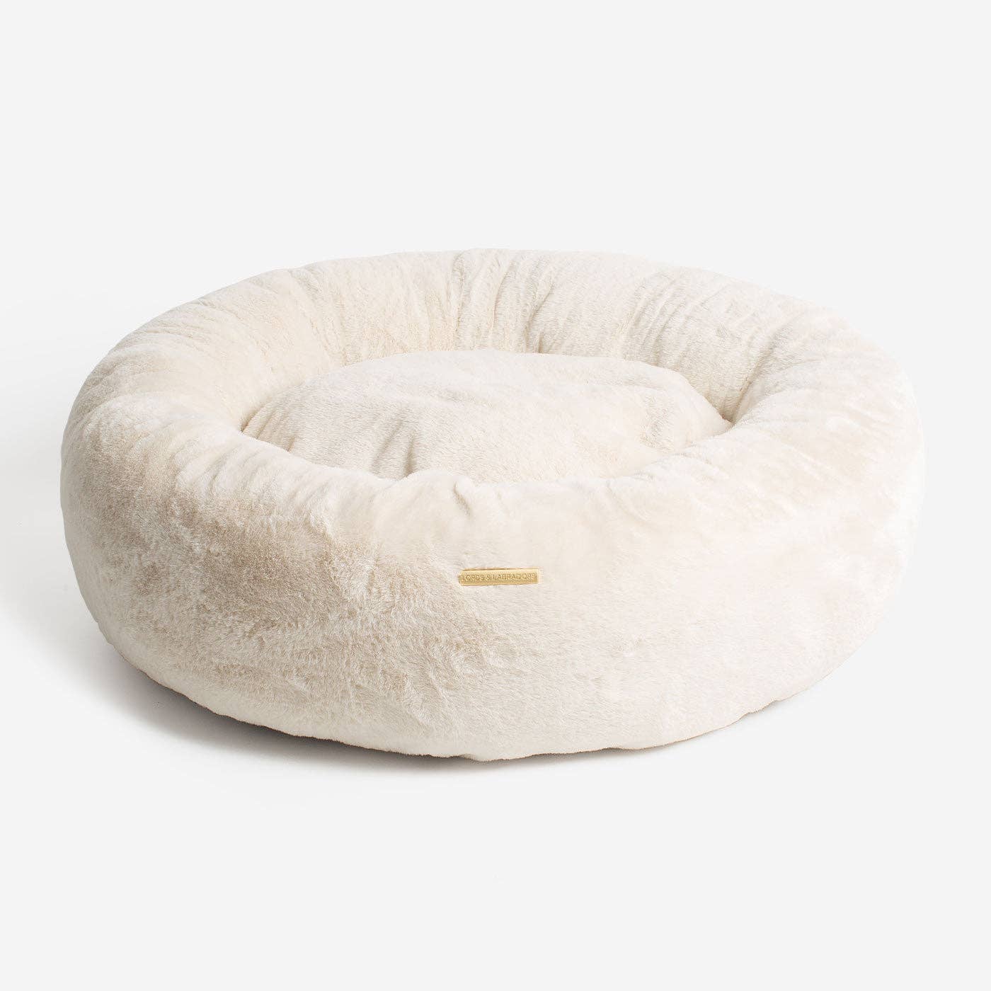 Calming Anti-Anxiety Donut Bed With Removable Covers in Cream Faux Fur by Lords & Labradors for wholesale on Faire3