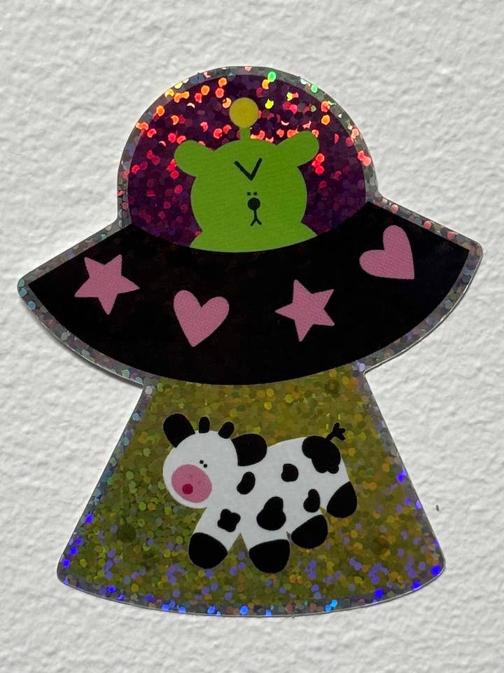 Autocollant en vinyle brillant et pailleté d'enlèvement par OVNI pour la vente par Rolly Poly Studios