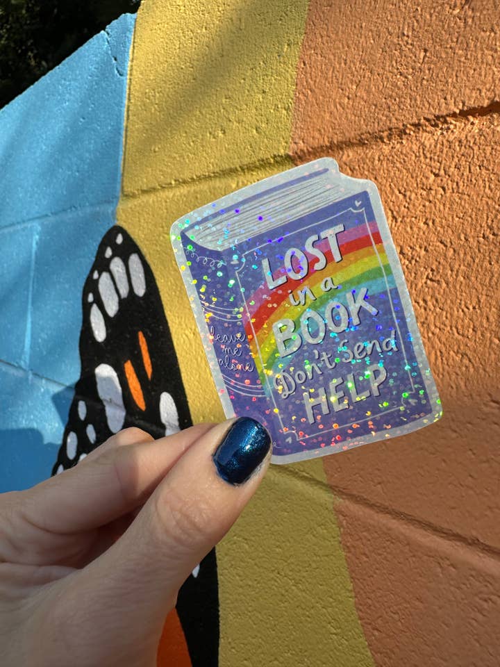 Lost In A Book Don't Send Help Glitter Sticker for wholesale by Hilarious Humanitarian