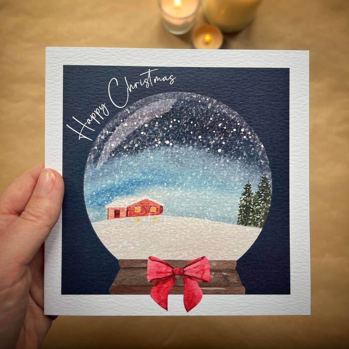 Cabin Snow Globe Christmas card for wholesale by Heather Trefusis Art