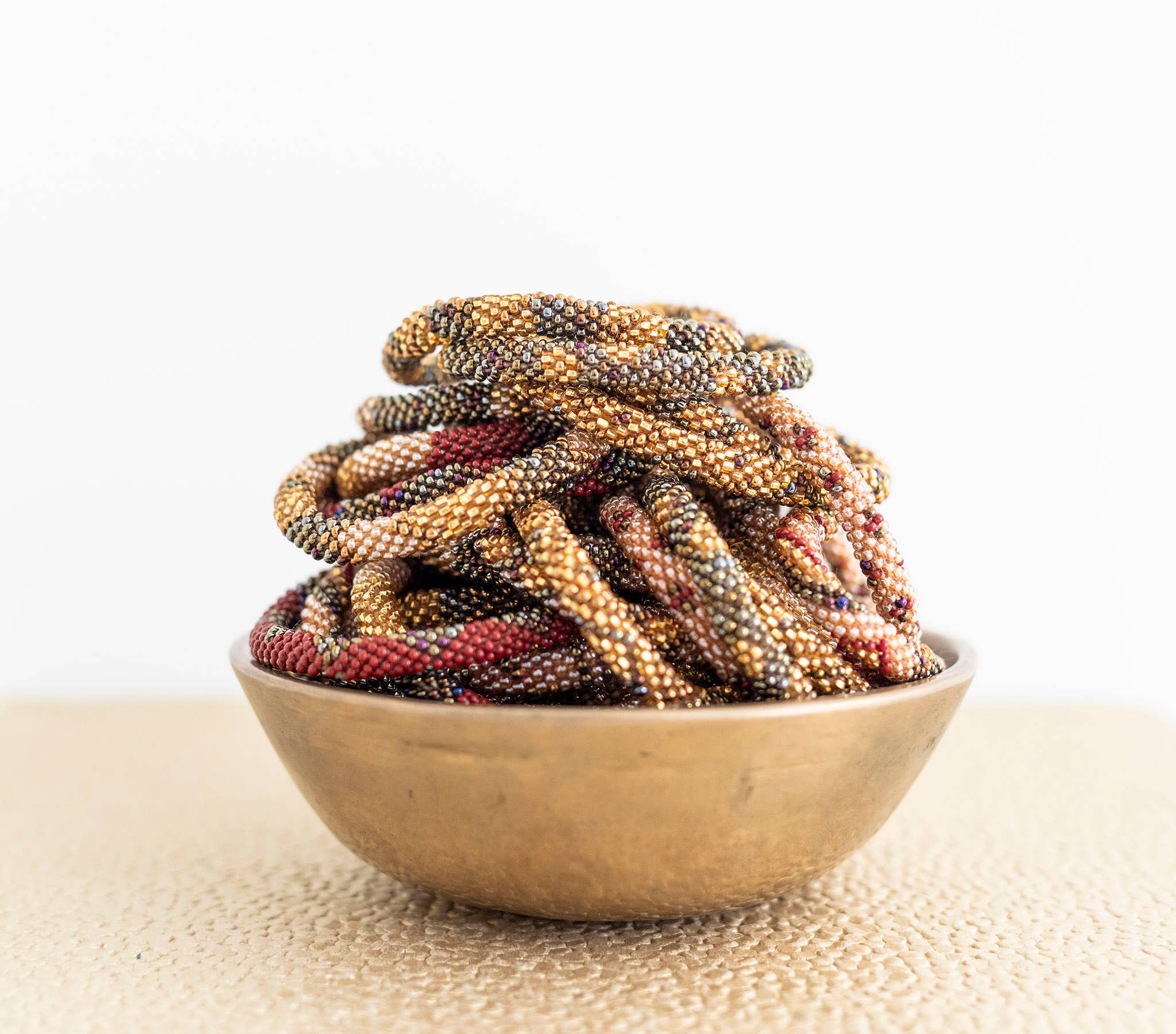 Aid Through Trade - Wholesale Beaded Bracelet - Roll-On® Bracelets - Chestnut Set of 121