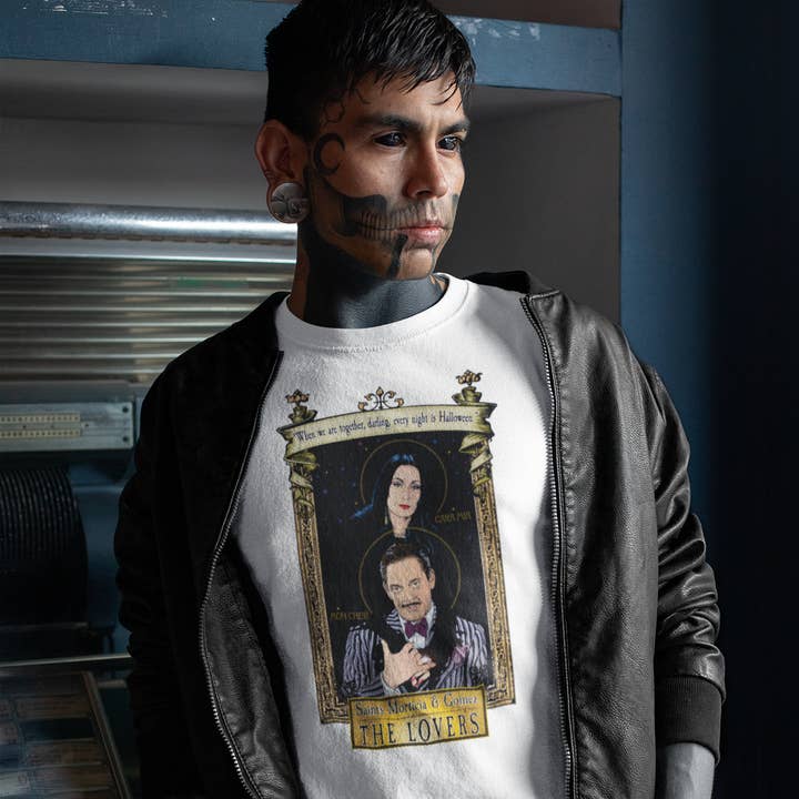 Saint Morticia and Gomez 🖤 T-Shirt for wholesale by Cleaver And Blade