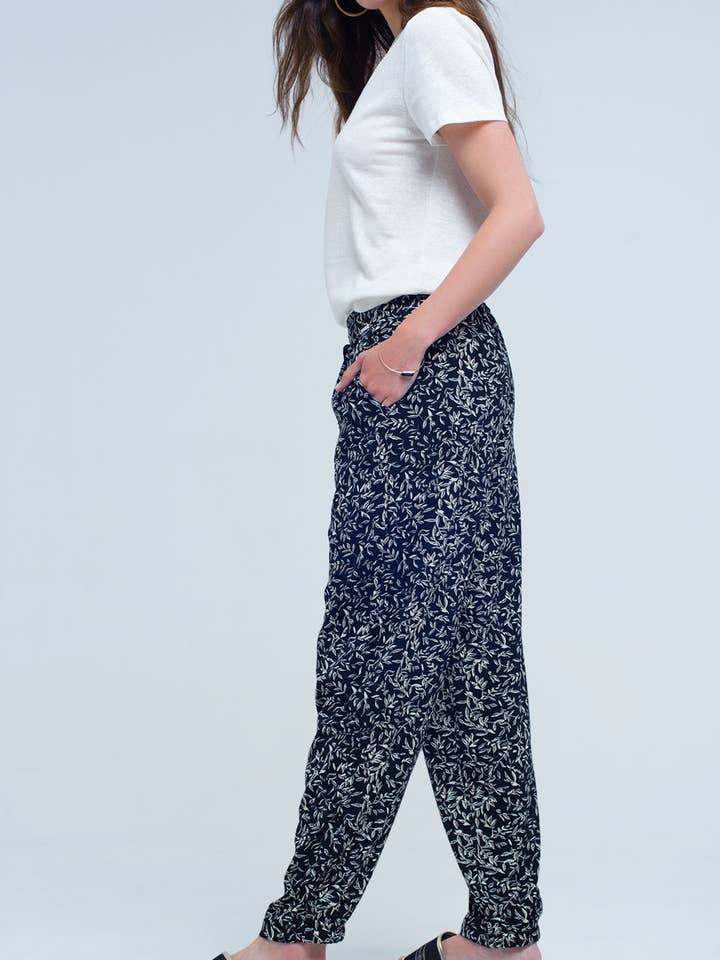 Pantaloni neri con fogli stampati e tasche per la vendita all'ingrosso da parte di Q2—All Orders:Free Duties for the US,UK,and Canada